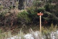 Wooden signage in the middle of a snowy forest with French words Chemin de ronde cabane de Salode