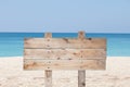 Wooden signboard on blue sky and on tropical beach for summer ba Royalty Free Stock Photo