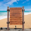 Wooden signboard on blur beach background. Royalty Free Stock Photo