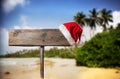 Wooden signboard with Christmas hat Royalty Free Stock Photo