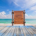 wooden signboard and wood floor on beach for summer background. Royalty Free Stock Photo