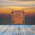 wooden signboard and wood floor on beach for summer background. Royalty Free Stock Photo