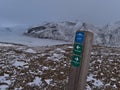 Wooden signpost in VatnajÃÂ¶kull National Park in winter leading to KristÃÂ­nartindar mountain with glacier SkaftafellsjÃÂ¶kull. Royalty Free Stock Photo