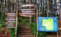 Wooden signpost and information map at main gate to Pinus Pengger forest in Yogyakarta