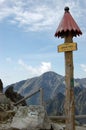 Wooden signpost on a path in the High Tatras Mountains in a summer, Slovakia Royalty Free Stock Photo