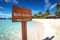 Wooden signpost on sandy beach at Maldives with inscription Bora Bora, Bora Bora wooden sign with beach background, AI Generated