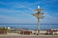 Wooden signpost showing in multiple different directions at beach on island Texe