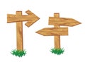 Wooden signpost standing in grass set isolated Royalty Free Stock Photo