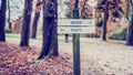 Wooden Signpost for West and East Directions