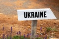 wooden signpost with the word Ukraine