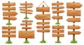 Wooden signposts with multiple arrow directions and rectangular panels. Each