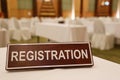 Wooden signs of registration on a table.