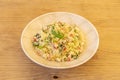 Wooden simile plate with recipe for vegetable tabbouleh with olive oil