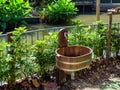 Wooden sink and water tap for kid washing hands after playing outdoor in nature background. Royalty Free Stock Photo