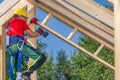 Wooden Skeleton Frame Building Performed by Caucasian Construction Worker Royalty Free Stock Photo