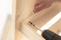 Wooden slats and working tools. Carpentry work. The self-tapping screw is screwed into the wooden plank Royalty Free Stock Photo