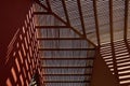 A Wooden slatted roof feature at a small Hotel next to a beach on the Island of Mauritius, with sunlight casting shadows.