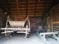 Wooden sled and the wooden cart in the barn Royalty Free Stock Photo