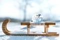 Wooden sledge with a crystal or glass ball, winter landscape reflection with christmas balls Royalty Free Stock Photo