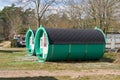 Wooden sleeping barrel to spend the night on a campsite