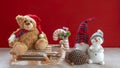 Wooden sleigh with teddy bear, snowman, pixy, candy cane and pine cones