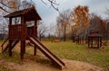 wooden slide in the children\'s park in autumn