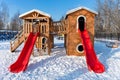 wooden slide in the children's park in winter