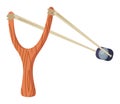 a wooden slingshot shoots a stone. children toy.