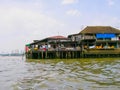 Wooden slums on stilts the riverside of Chao Praya River in Bangkok, Thailand Royalty Free Stock Photo