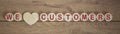 Wooden small circles with words we love customers on wood background. Concept image