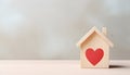 Wooden small house with red heart for happy family. Real estate, sweet home, investment, mortgage and buy new property