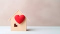 Wooden small house with red heart for happy family. Real estate, sweet home, investment, mortgage and buy new property