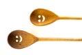 Wooden smiley face spoons on white background Royalty Free Stock Photo