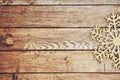 Wooden Snowflake On A Weathered Wood Background