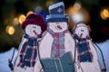 Wooden snowman trio still life Royalty Free Stock Photo