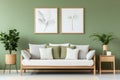 Wooden sofa with white cushions near green wall with art poster frame. Scandinavian interior design Royalty Free Stock Photo