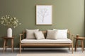 Wooden sofa with white cushions near green wall with art poster frame. Scandinavian interior design Royalty Free Stock Photo