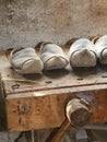 Wooden soled type dutch clogs and a wooden vise Royalty Free Stock Photo