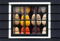 Wooden souvenir clogs behind a window Royalty Free Stock Photo
