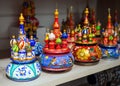 Wooden souvenirs in the form of temple of Vasily Blazhenny stand on a shelf souvenir shop