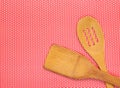 Wooden spatula for cooking on a polka dot tablecloth, top view. Royalty Free Stock Photo