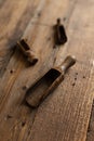 Wooden spice spoons on a wooden background