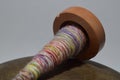 Wooden spindle with hand spun yarn