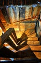 Wooden spiral staircase in an old wooden house Royalty Free Stock Photo