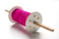 Wooden Spool or chakri/reel/fikri with pink or white thread Royalty Free Stock Photo