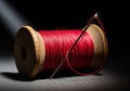 Wooden spool of red sewing thread with threaded needle on dark background close up view Royalty Free Stock Photo