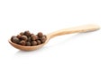 Wooden spoon with allspice pepper grains Royalty Free Stock Photo