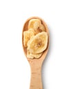 Wooden spoon with banana slices on white background, top view. Dried fruit Royalty Free Stock Photo