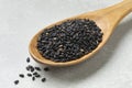 Wooden spoon with black roasted sesame seeds Royalty Free Stock Photo