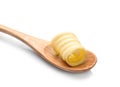 Wooden spoon with butter curl Royalty Free Stock Photo